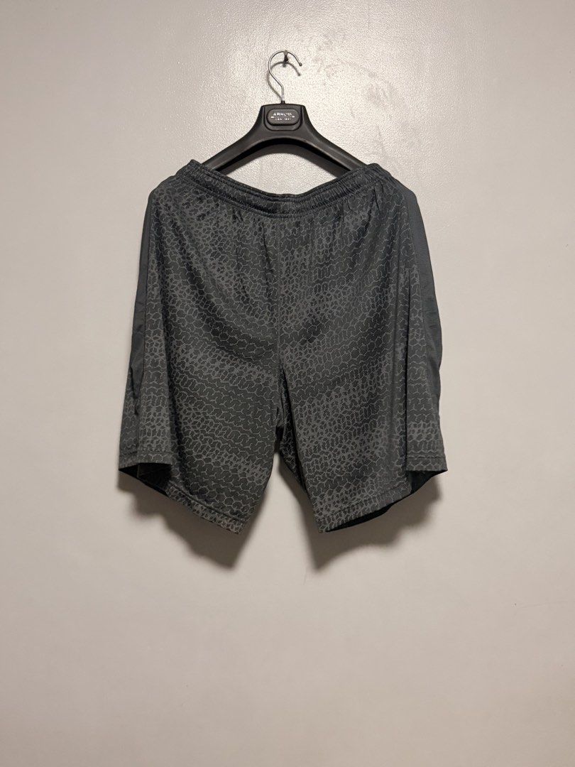 Under Armour Athletic Shorts Grey Patterned (Category: Shorts) located in Manila. Submitted by swiftgem.eeb06e (Listing ID 1468390241, Image 2). Description: - Brand: Under Armour - Color: Grey with all-over geometric pattern - Fit: Elastic waistband with adjustable drawstring - Material: Lightweight and breathable - Ideal for: Gym workouts, running, or casual wear - Condition: Clean, excellent, ready to wear - Dimes: 17.5x20in - Condition: 9/10.