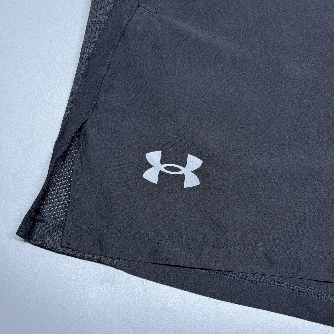 Under Armour Fitted Black Athletic Shorts (Category: Shorts) located in Kabacan. Submitted by rags2penny.phl (Listing ID 1468331649, Image 2). Description: - Brand: Under Armour - Color: Black - Size: L (Fitted design) - Material: 100% polyester, made in Indonesia - Features: Lightweight fabric, adjustable drawstring waistband, and breathable mesh side panels - Details: Small UA logo near the hem - Condition: Great for workouts, running, and acti