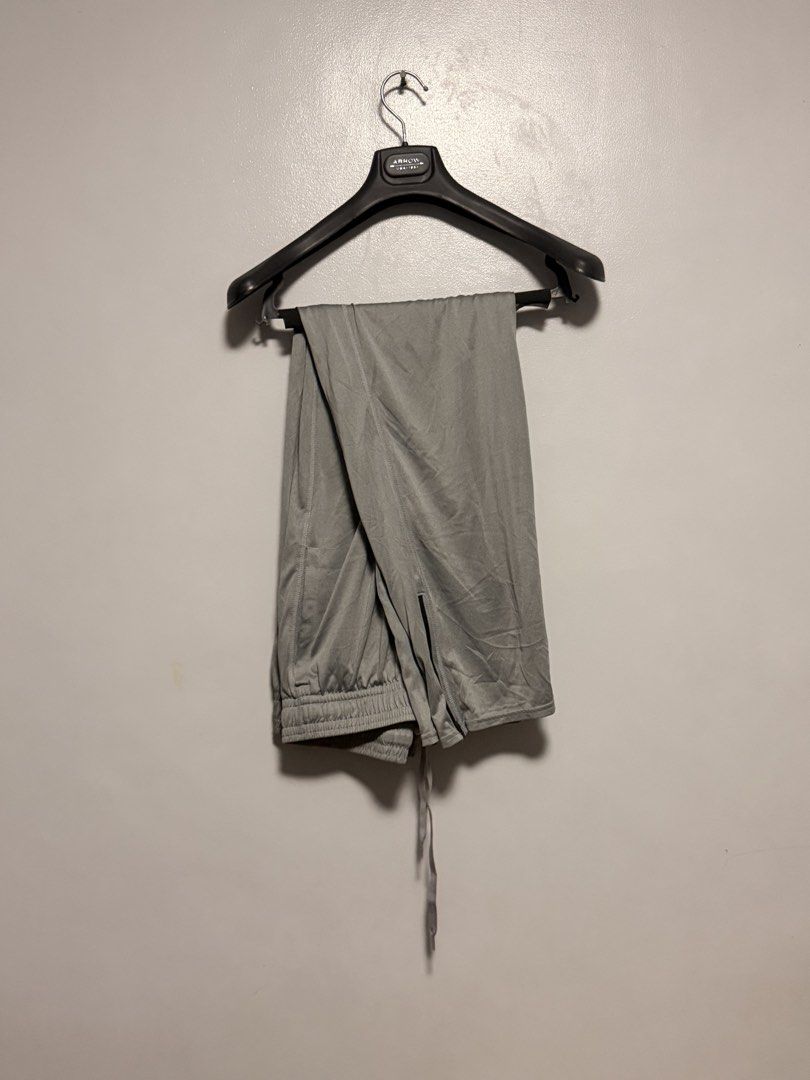 Under Armour Grey Athletic Sweatpants (Category: Joggers) located in Manila. Submitted by swiftgem.eeb06e (Listing ID 1468390232, Image 2). Description: - Brand: Under Armour - Color: Versatile grey - Fit: Elastic waistband with matching adjustable drawstring - Detail: Distinct black Under Armour logo near the top hip - Material: Lightweight and breathable - Ideal for: Workouts, lounging, or daily errands - Condition: Clean and ready for a new ow