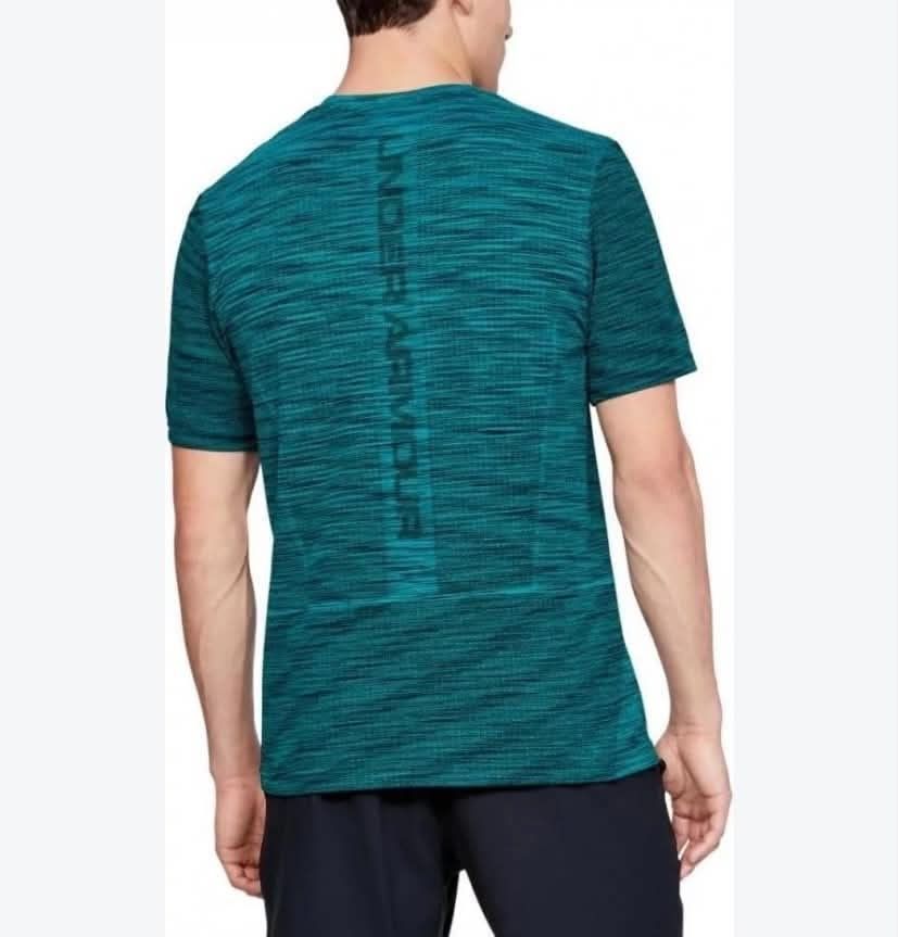 Under Armour Vanish Mens Seamless Running (Category: Activewear) located in Meycauayan. Submitted by epicforest_231b9d (Listing ID 1468396519, Image 3). Description: - Brand: Under Armour Vanish Men's Seamless Running Shirt - Color: Teal Heather - Size: XL (22" width x 32" length) - Material: Lightweight, breathable athletic fabric - Design: Subtle vertical Under Armour branding down the back - Condition: Excellent, zero flaws, snags, or stains -