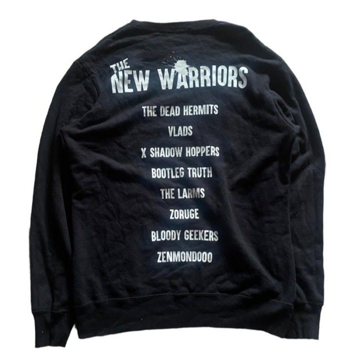 Undercover 19SS The New Warriors Sweatshirt (Category: Coats, Jackets and Outerwear) located in Manila. Submitted by rizu09 (Listing ID 1468409110, Image 3). Description: - Brand: Undercover (19SS The New Warriors Collection) - Color: Black - Size: Tagged Size 2 - Material: 100% Cotton, Made in Japan - Design: Circle logo on chest, band names listed on the back - Condition: Heavy rotation piece with minor wear on fabric.
