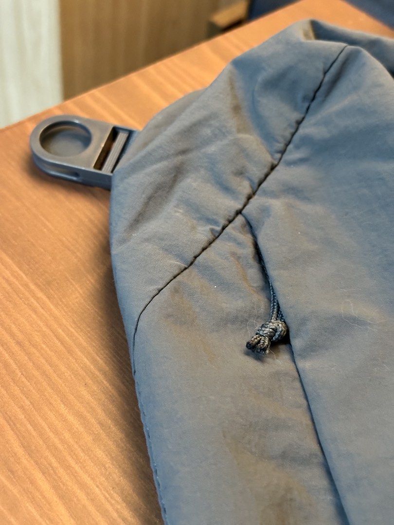 Uniqlo Crossbody Bag Blue (Category: Sling Bags) located in Baguio. Submitted by sammieong (Listing ID 1468486964, Image 3). Description: - Color: Blue - Material: Durable nylon - Strap: Padded single strap with buckle closure - Pockets: Zippered front pocket with knotted cord pull - Condition: Minor lint marks on the fabric surface - Best for: Lightweight and practical everyday carry - Location: Makati.