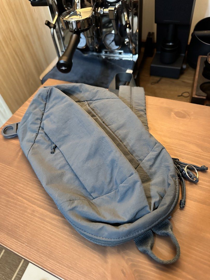 Uniqlo Crossbody Bag Blue (Category: Sling Bags) located in Baguio. Submitted by sammieong (Listing ID 1468486964, Image 1). Description: - Color: Blue - Material: Durable nylon - Strap: Padded single strap with buckle closure - Pockets: Zippered front pocket with knotted cord pull - Condition: Minor lint marks on the fabric surface - Best for: Lightweight and practical everyday carry - Location: Makati.