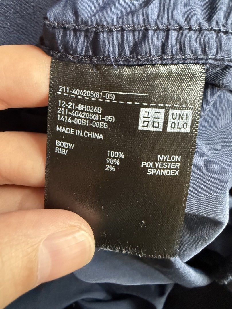 Uniqlo Navy Blue Bomber Jacket (Category: Coats, Jackets and Outerwear) located in Makati City. Submitted by joyfulliving22 (Listing ID 1468322509, Image 3). Description: - Brand: Uniqlo - Color: Navy blue - Material: 100% nylon with polyester/spandex ribbing - Features: Full zip front, ribbed collar/cuffs/hem, two front hand pockets - Condition: Clean inside and out - Style: Great lightweight layer for breezy weather.