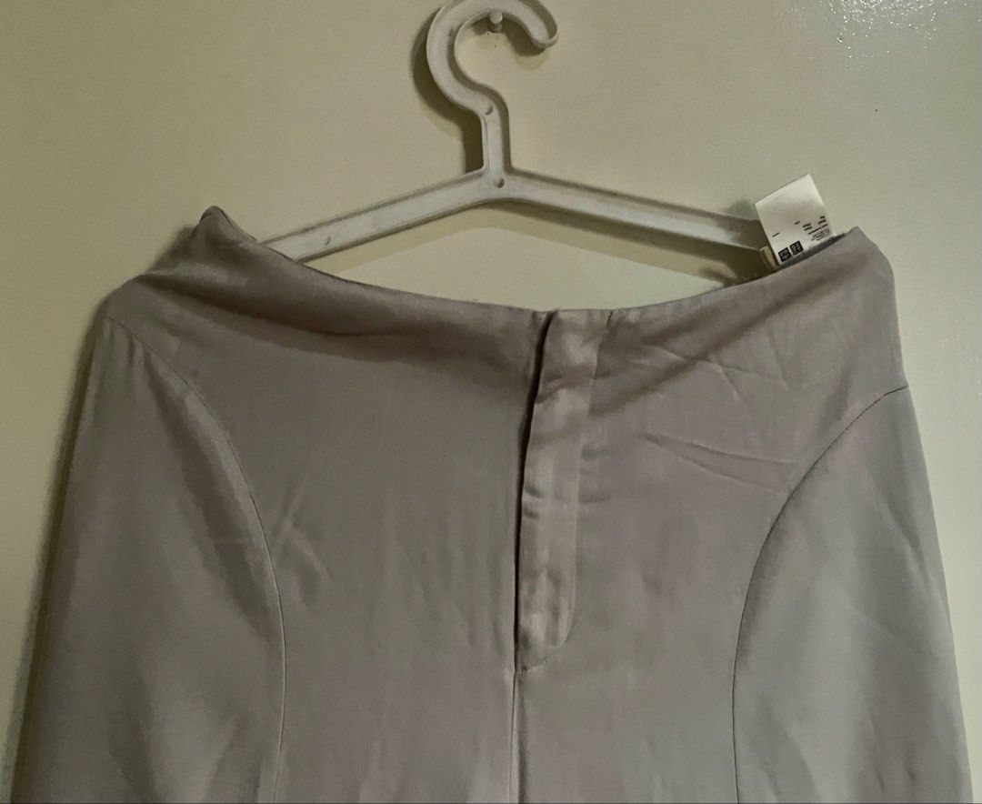Uniqlo wide leg pants (Category: Other Bottoms) located in Quezon City. Submitted by itgsta (Listing ID 1468295675, Image 3). Description: - Brand/Collab: Uniqlo and H+ - Color: beige - Style: Wide leg with a comfortable flowy drape - Material: 100% Rayon - Size (Tag): Waist 73cm, Hips 99cm Approx measurement 15” across waist Length 35” .