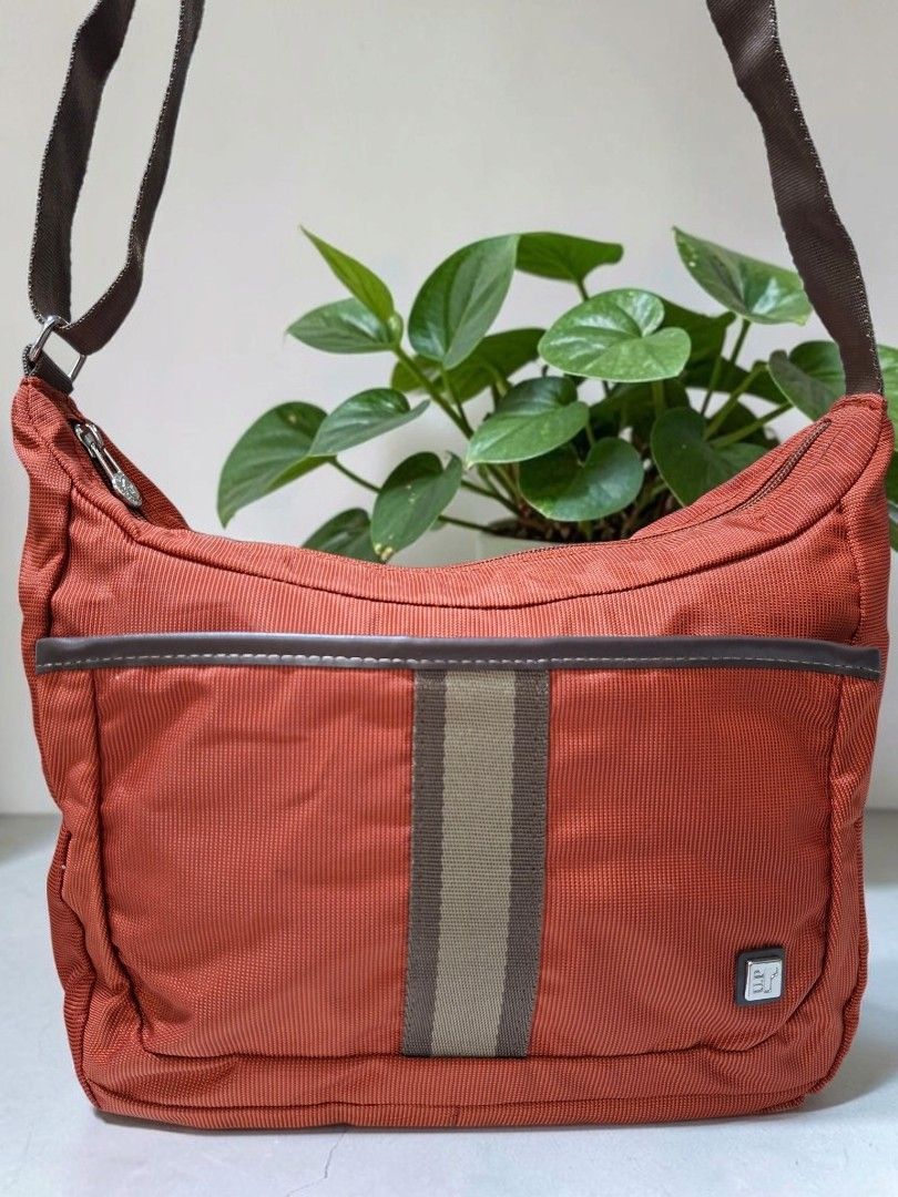 U.P RENOMA NYLON SLING IN RUST (Category: Cross-body Bags) located in Las Pinas. Submitted by annachiaonair2037 (Listing ID 1468392786, Image 3). Description: U.P RENOMA NYLON CROSSBODY SLING IN RUST COLOR FROM JAPAN PRODUCED BY ACE CO.LTD ADJUSTABLE STRAP H 7.5" L 11.5" W 4" Disclaimer: I am not affiliated with, associated with, or authorized by any of the brands featured posted. Any mention of brand names, trademarks, or logos is solely for ide