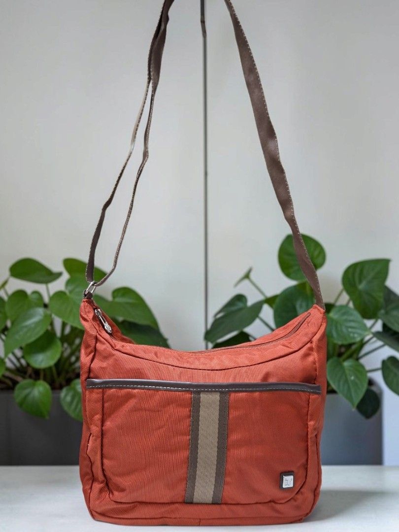 U.P RENOMA NYLON SLING IN RUST (Category: Cross-body Bags) located in Las Pinas. Submitted by annachiaonair2037 (Listing ID 1468392786, Image 2). Description: U.P RENOMA NYLON CROSSBODY SLING IN RUST COLOR FROM JAPAN PRODUCED BY ACE CO.LTD ADJUSTABLE STRAP H 7.5" L 11.5" W 4" Disclaimer: I am not affiliated with, associated with, or authorized by any of the brands featured posted. Any mention of brand names, trademarks, or logos is solely for ide