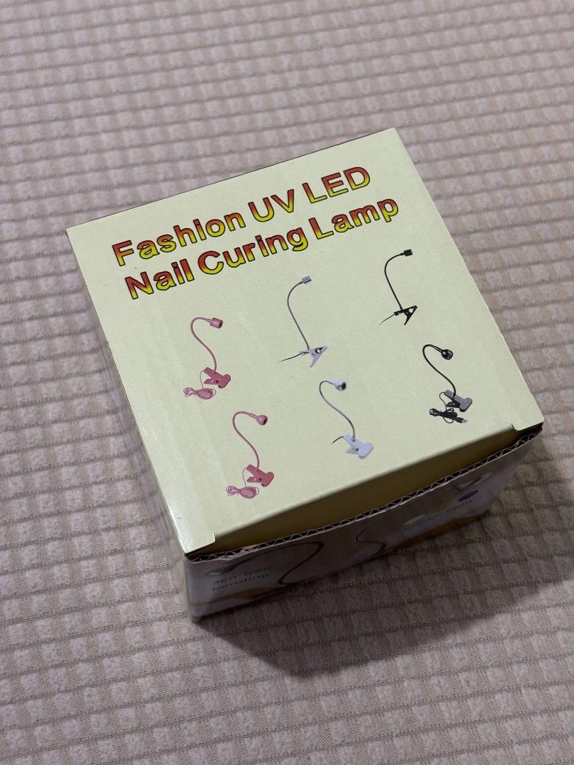 UV LED Nail Curing Lamp (Category: Hands & Nails) located in Cabanatuan. Submitted by club.sissy (Listing ID 1468377524, Image 2). Description: Fashion UV LED Nail Curing Lamp 💅🏻✨ Brand new! Never used wala na kasing time mag-nails at home kaya decluttering na lang. 🤍 ✨ USB-powered ✨ Flexible 360° lamp holder ✨ 3-color light ✨ With clip for easy positioning 💰 Original price: ₱200 🏷️ Selling price: ₱120 ONLY 📩 DM us or comment “mine” to rese