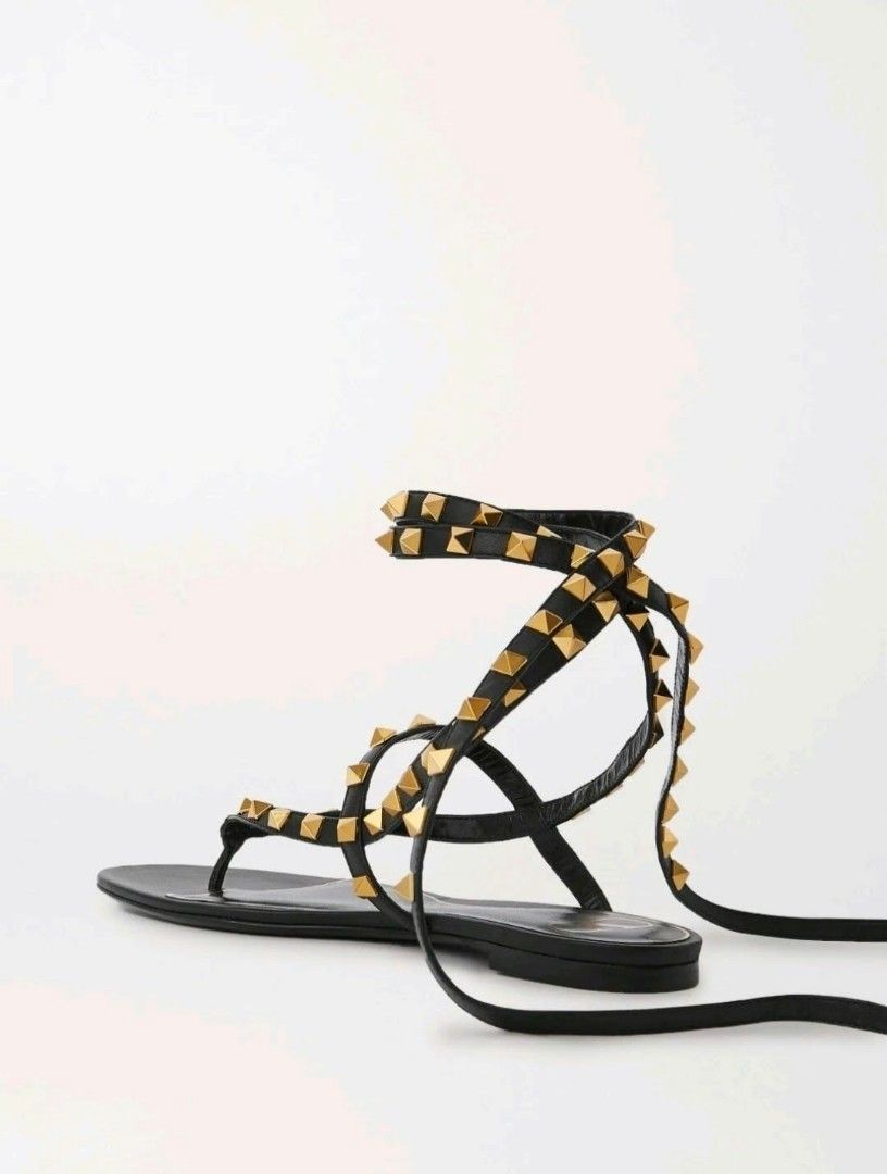 Valentino Garavani Rockstud Wrap Gladiator Sandals Black (Category: Flats & Sandals) located in Paranaque City. Submitted by calm_youngstore7 (Listing ID 1468099219, Image 2). Description: 90% OFF RETAIL! Valentino Gladiator Rockstud Sandals Updated version of Valentino Garavani's gladiator-inspired 'Rockstud' sandals has athong strap and ties that wrap around your ankles. Set on a slight heel, made in Italy from smooth leather and hand-embellish