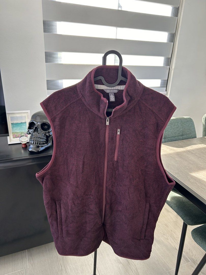 Van Heusen Fleece Vest (M) (Category: Vests) located in Dasmarinas. Submitted by sfclosetcleanup (Listing ID 1468344210, Image 3). Description: - Brand: Van Heusen - Color: Deep maroon - Size: Medium - Material: Soft fleece throughout - Closure: Full front zip - Pockets: 1 vertical chest zip pocket, 2 open hand pockets - Collar: Stand-up collar for extra warmth.
