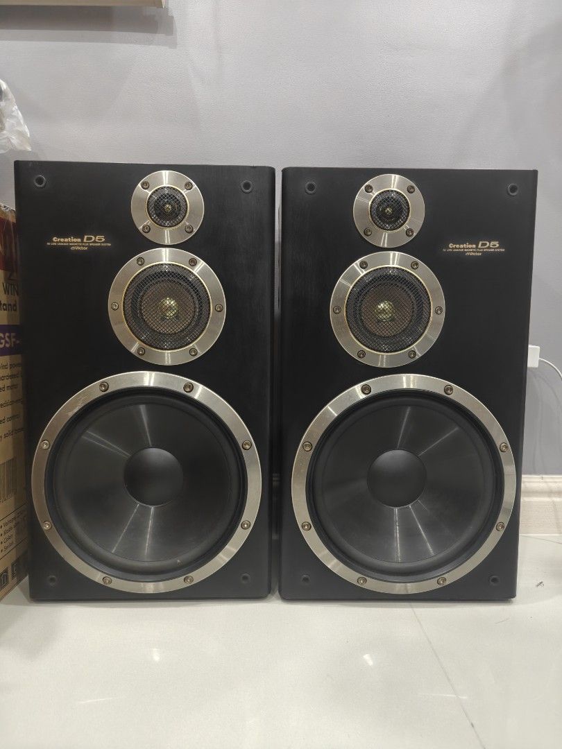 Victor Creation D5 3-Way Speaker System Pair (Category: Soundbars, Speakers & Amplifiers) located in Quezon City. Submitted by goldsiy456 (Listing ID 1468422990, Image 1). Description: - Model: Victor Creation D5 loudspeakers (Pair) - Design: Black cabinets with gold-tone trim rings - Drivers: Three per speaker (tweeter, midrange, large woofer) - Condition: Good working order, , minor wear on some metal rings and cabinet laminate - Sound Quality: