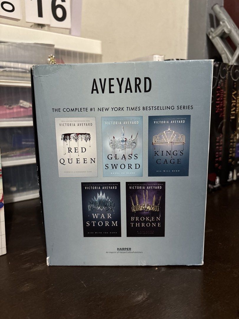 Victoria Aveyard Red Queen Series Complete Box Set (Category: Storybooks) located in Tanauan. Submitted by jessyguce (Listing ID 1468444137, Image 3). Description: - Complete NYT Bestselling Series: Includes Red Queen, Glass Sword, King's Cage, War Storm, and Broken Throne - Format: Paperback editions in the original slipcase box - Author: Victoria Aveyard - Condition: Books are well-kept, with slight shelf wear along the top and bottom edges of 