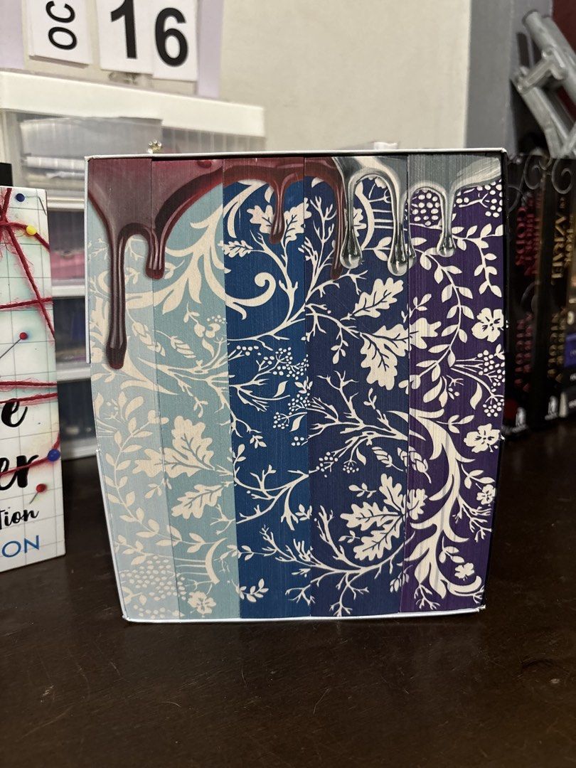 Victoria Aveyard Red Queen Series Complete Box Set (Category: Storybooks) located in Tanauan. Submitted by jessyguce (Listing ID 1468444137, Image 1). Description: - Complete NYT Bestselling Series: Includes Red Queen, Glass Sword, King's Cage, War Storm, and Broken Throne - Format: Paperback editions in the original slipcase box - Author: Victoria Aveyard - Condition: Books are well-kept, with slight shelf wear along the top and bottom edges of 