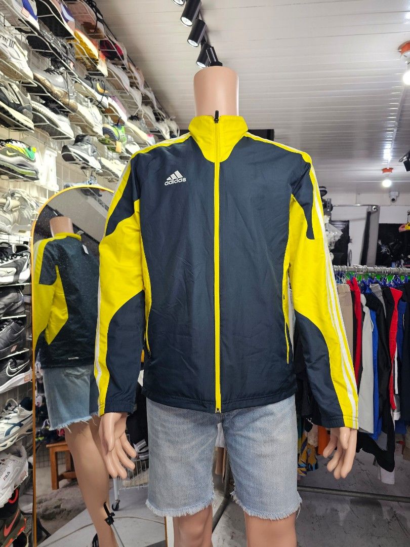 vintage Adidas colorblock windbreaker jacket (Category: Coats, Jackets and Outerwear) located in Baguio. Submitted by kayeonlineshop (Listing ID 1468302111, Image 1). Description: -vintage Adidas colorblock windbreaker jacket in black/navy and bright yellow with white three-stripe sleeve accents..