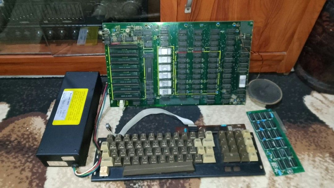 Vintage Apple II clone MADE IN JAPAN (Category: Desktops) located in Manila. Submitted by 1980sbaby (Listing ID 1468305055, Image 1). Description: - Retro computing kit with motherboard made in Japan - Includes keyboard with numeric keypad, power supply, speaker, and extra interface card - Motherboard features multiple expansion slots, IC chips, and labeled ROM, RAM, and I/O sections - Untested vintage hardware - Ideal project for collectors and 