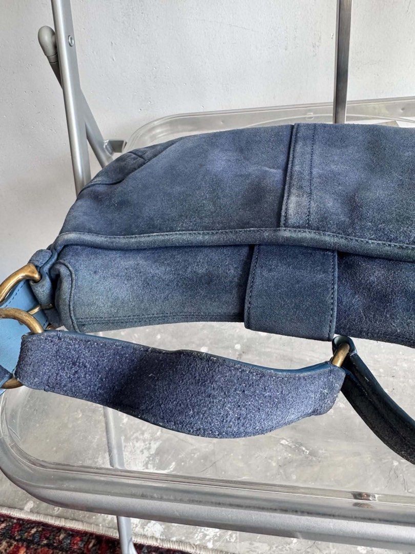 Vintage Coach Blue Suede Shoulder Bag (Category: Shoulder Bags) located in Manila. Submitted by prettyyybagss (Listing ID 1468385312, Image 3). Description: - Vintage Coach shoulder bag in striking blue suede with smooth leather trim - Adjustable strap and classic brass-tone hardware with front buckle closure - Interior features signature Coach monogram fabric, zippered pocket, and authentic creed patch - Reliable YKK zipper hardware - Shows expe