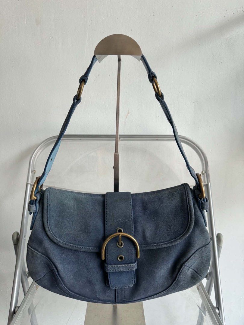Vintage Coach Blue Suede Shoulder Bag (Category: Shoulder Bags) located in Manila. Submitted by prettyyybagss (Listing ID 1468385312, Image 1). Description: - Vintage Coach shoulder bag in striking blue suede with smooth leather trim - Adjustable strap and classic brass-tone hardware with front buckle closure - Interior features signature Coach monogram fabric, zippered pocket, and authentic creed patch - Reliable YKK zipper hardware - Shows expe