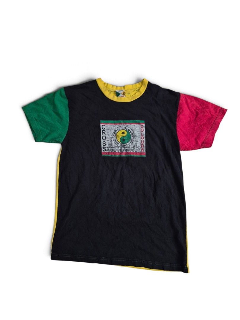 Vintage cross colours tee size medium on tag (Category: Activewear) located in Manila. Submitted by ifyouknowyouknow_ (Listing ID 1468331648, Image 1). Description: vintage Cross Colours black graphic t-shirt featuring a colorblocked design with a red right sleeve, a green left sleeve, a yellow crewneck collar, and a central graphic square with a yin-yang symbol. size medium on tag.