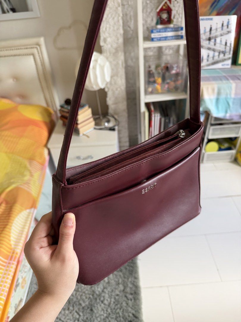 Vintage Esprit Burgundy Shoulder Bag (Category: Shoulder Bags) located in Cebu City. Submitted by sayonarasells (Listing ID 1468312347, Image 2). Description: - Brand: ESPRIT - Color: Rich deep burgundy / maroon - Style: Sleek rectangular shoulder bag with a slim strap - Storage: Secure top zipper closure, front slip pocket with metallic logo, and a convenient back zippered pocket - Versatility: Beautiful rich color that easily matches multiple o