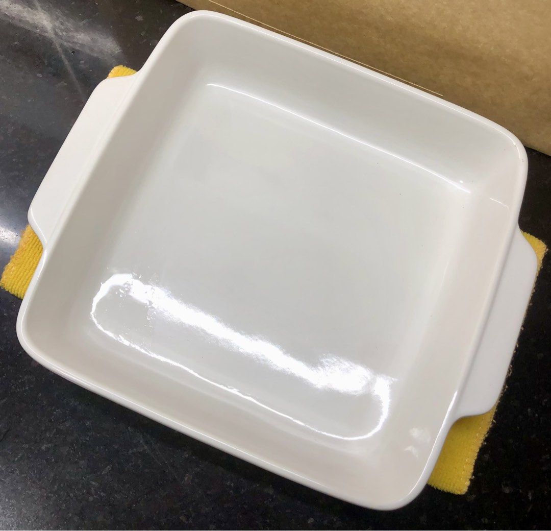Vintage Japanese Oven Proof White Ceramic Square Baking Dish (Category: Cookware & Accessories) located in Quezon City. Submitted by may.reyes (Listing ID 1468297980, Image 2). Description: - Type: Vintage white ceramic square baking dish - Origin: Made in Japan (stamped Oven Proof) - Design: Elegant fluted sides with convenient side handles - Size: Approximately 8 inches across - Condition: Clean interior glaze with minimal signs of prior use - 