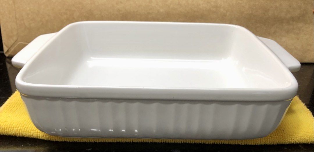 Vintage Japanese Oven Proof White Ceramic Square Baking Dish (Category: Cookware & Accessories) located in Quezon City. Submitted by may.reyes (Listing ID 1468297980, Image 1). Description: - Type: Vintage white ceramic square baking dish - Origin: Made in Japan (stamped Oven Proof) - Design: Elegant fluted sides with convenient side handles - Size: Approximately 8 inches across - Condition: Clean interior glaze with minimal signs of prior use - 