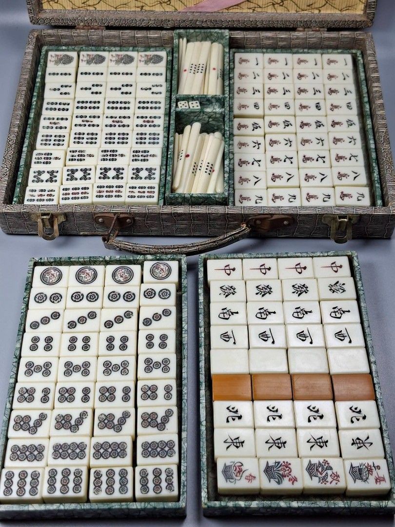 Vintage Mahjong Set with Case (Category: Board Games & Puzzles) located in Paranaque City. Submitted by lexajapansurplus (Listing ID 1468351943, Image 1). Description: 🀄 Vintage Mahjong Set 📌​ Complete 144 pieces of engraved tiles 📏 ​Tile Dimensions: 1" × 0.8" × 0.6" (inches) ​ - Complete set: characters, circles, bamboos, honors, flowers, seasons, plus scoring sticks and dice - Housed in a vintage faux-crocodile suitcase (note: exterior top s