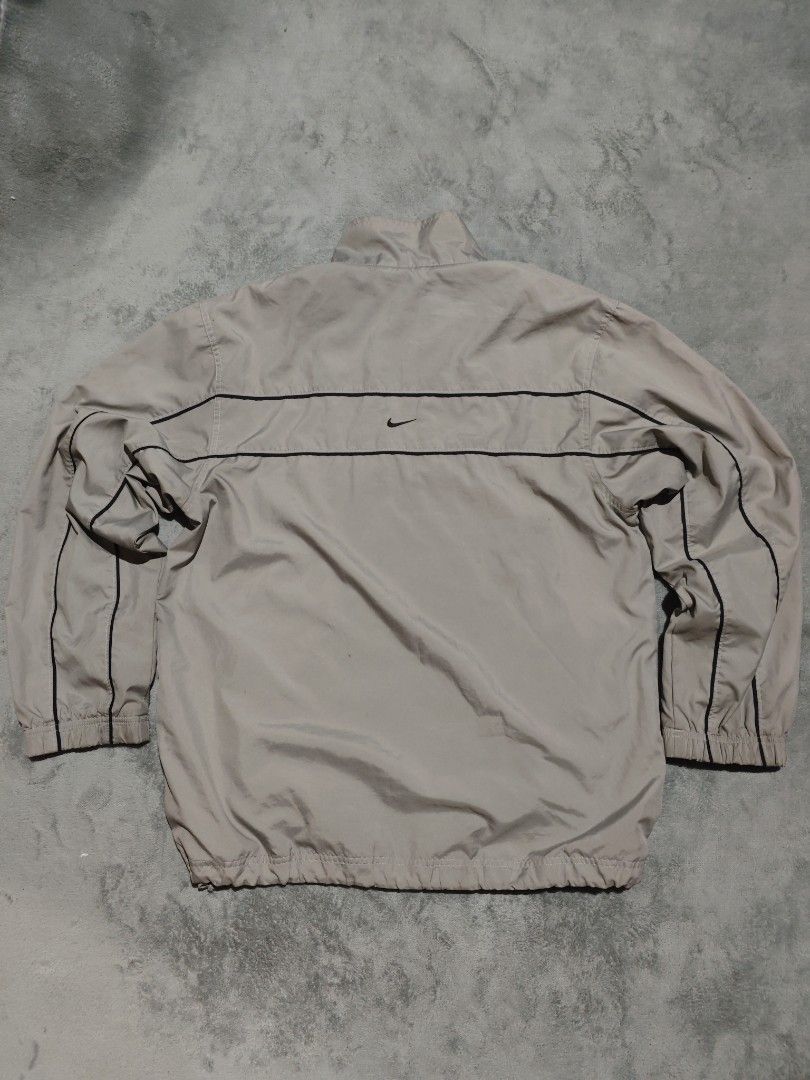 Vintage Nike 2Lines windbreaker (Category: Hoodies) located in Dagupan City. Submitted by johnny.flips (Listing ID 1468450874, Image 2). Description: 23W 29L Gray Color way in excellent condition needs wash only.
