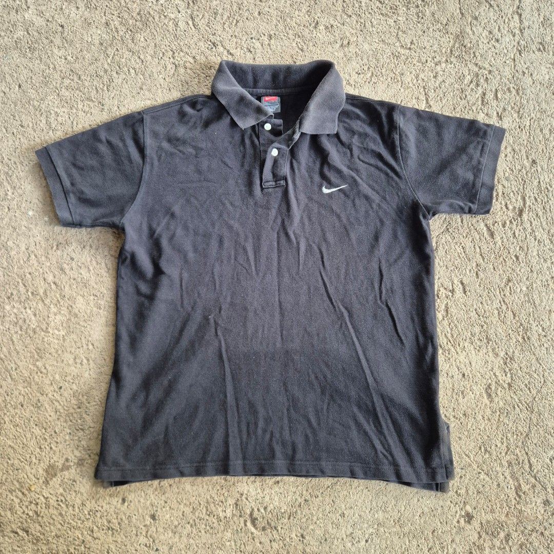 Vintage Nike Black Polo (Category: Tshirts & Polo Shirts ) located in General Santos City (Dadiangas). Submitted by madeby.ryb (Listing ID 1468452367, Image 1). Description: •Authentic Nike — Red "Team" Tag •size: 22W ×25L •Mini swoosh × Timeless all-black •Solid condition.