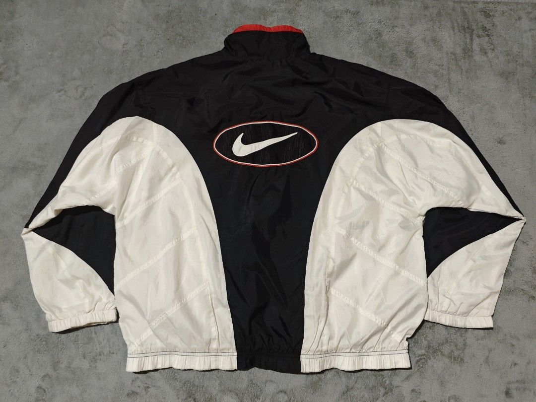 Vintage Nike Oval Windbreaker (Category: Coats, Jackets and Outerwear) located in Dagupan City. Submitted by johnny.flips (Listing ID 1468451238, Image 1). Description: 26.5W 27L good condition check pics for issues last pic is inside stain only.