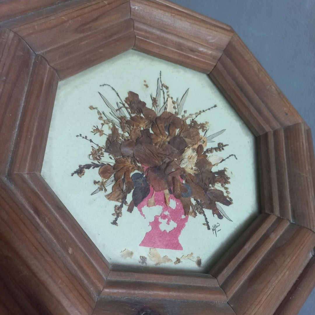 Vintage Octagonal Pressed Flower Frame (Category: Frames & Pictures) located in Imus. Submitted by mj.trinidad (Listing ID 1468391714, Image 1). Description: 350. - Octagon wooden frame - Pressed botanical art featuring dried brown flowers in a floral hairstyle silhouette - Features a charming pink profile cutout against a light background - Signed by the artist on the bottom right - Compact size, ready to hang with an attached metal ring on the 