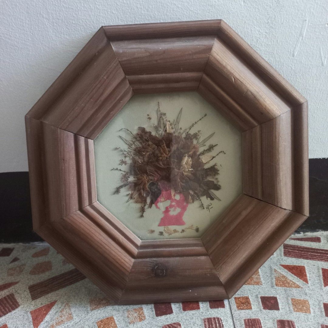 Vintage Octagonal Pressed Flower Frame (Category: Frames & Pictures) located in Imus. Submitted by mj.trinidad (Listing ID 1468391714, Image 2). Description: 350. - Octagon wooden frame - Pressed botanical art featuring dried brown flowers in a floral hairstyle silhouette - Features a charming pink profile cutout against a light background - Signed by the artist on the bottom right - Compact size, ready to hang with an attached metal ring on the 