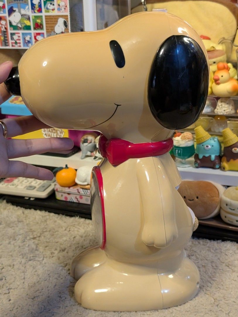 Vintage Snoopy Coinbank Clock (Category: Clocks) located in San Pedro. Submitted by eurisilvers (Listing ID 1468332708, Image 2). Description: Has scratches, fades, yellowing, and corrosion but working po ang clock. Can store coins and bills inside too. Not working na po ang alarm. — shipping is via J&T Express — mop: gcash, maya, bank transfer — location: san pedro city, laguna.