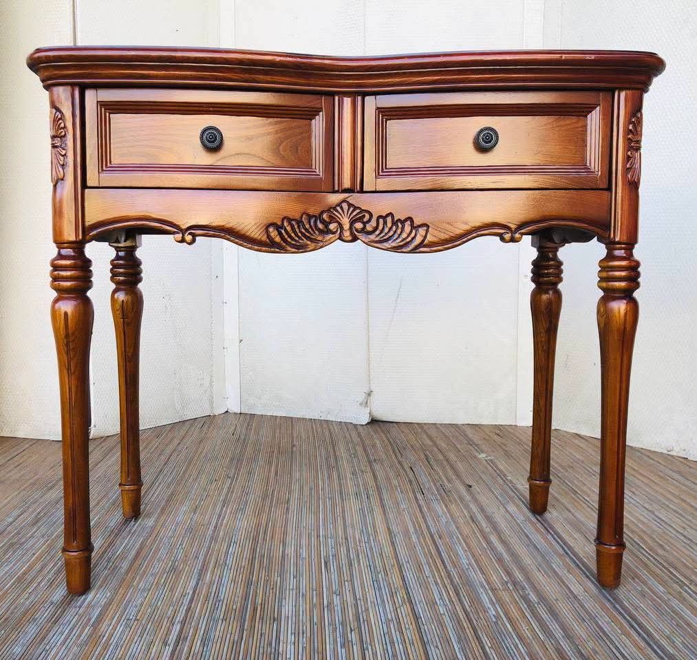 Vintage Wooden Console Table with Two Drawers (Category: Tables & Sets) located in Antipolo. Submitted by roselle001 (Listing ID 1468311639, Image 1). Description: - Material: Solid wood with rich brown finish and natural wood grain - Storage: Two pull-out drawers with sleek round black knobs - Design: Intricate carved details on the apron and sides - Legs: Classic turned legs with detailed upper segments - Placement: Medium-sized console table, 