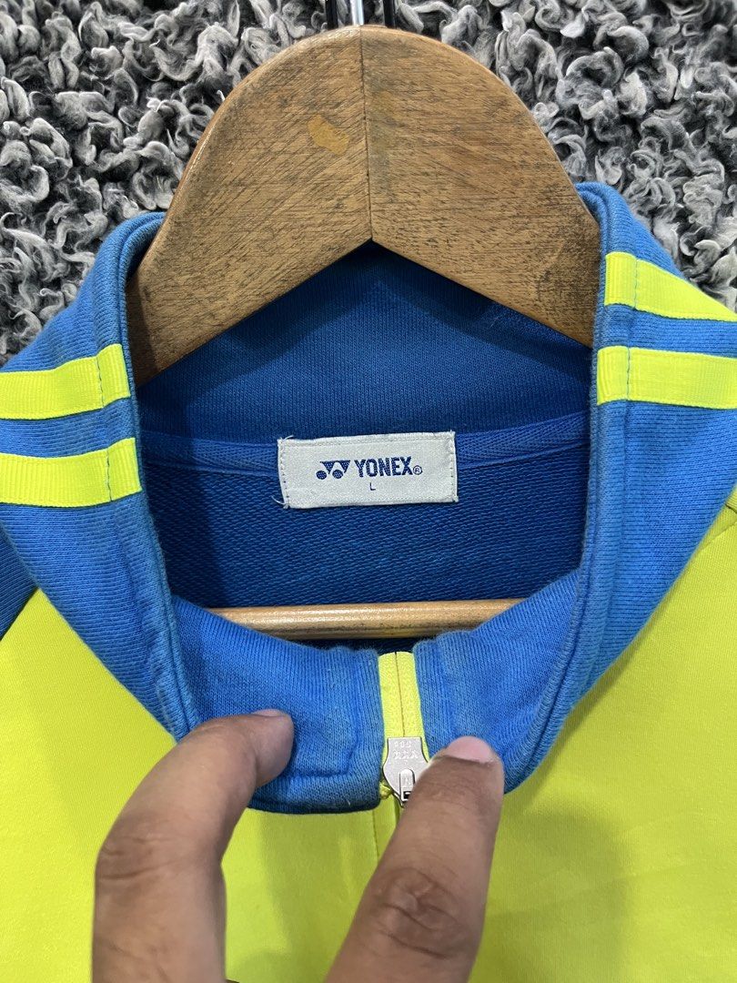 Vintage Yonex full-zip track jacket | Size L (Category: Coats, Jackets and Outerwear) located in General Trias. Submitted by zrchustle.604 (Listing ID 1468386188, Image 3). Description: vintage yellow and blue Yonex full-zip track jacket featuring blue stripe details on the sleeves, the Yonex logo on the left chest, and a large "No limit - The Revolution in the Game" graphic on the right chest..