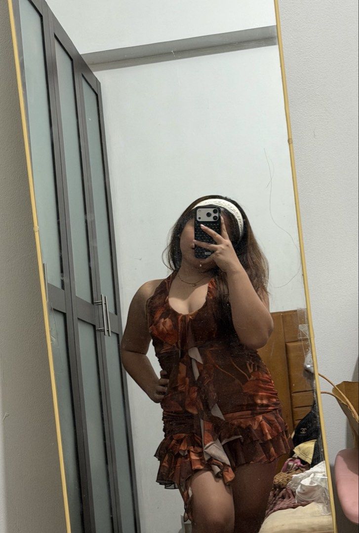 V-Neck Ruffle Summer Sexy Dress (Category: Dresses) located in Makati City. Submitted by chariethrifts (Listing ID 1468305579, Image 3). Description: - Brand/Style: SHEIN Allurite brown floral print mini dress - Design: Halter neckline with deep V-cut, flattering ruched body, and layered asymmetric ruffle hem - Material: Lightweight mesh fabric in gorgeous brown and orange tones - Condition: Worn once for a mirror try-on, fresh, clean, and ready 