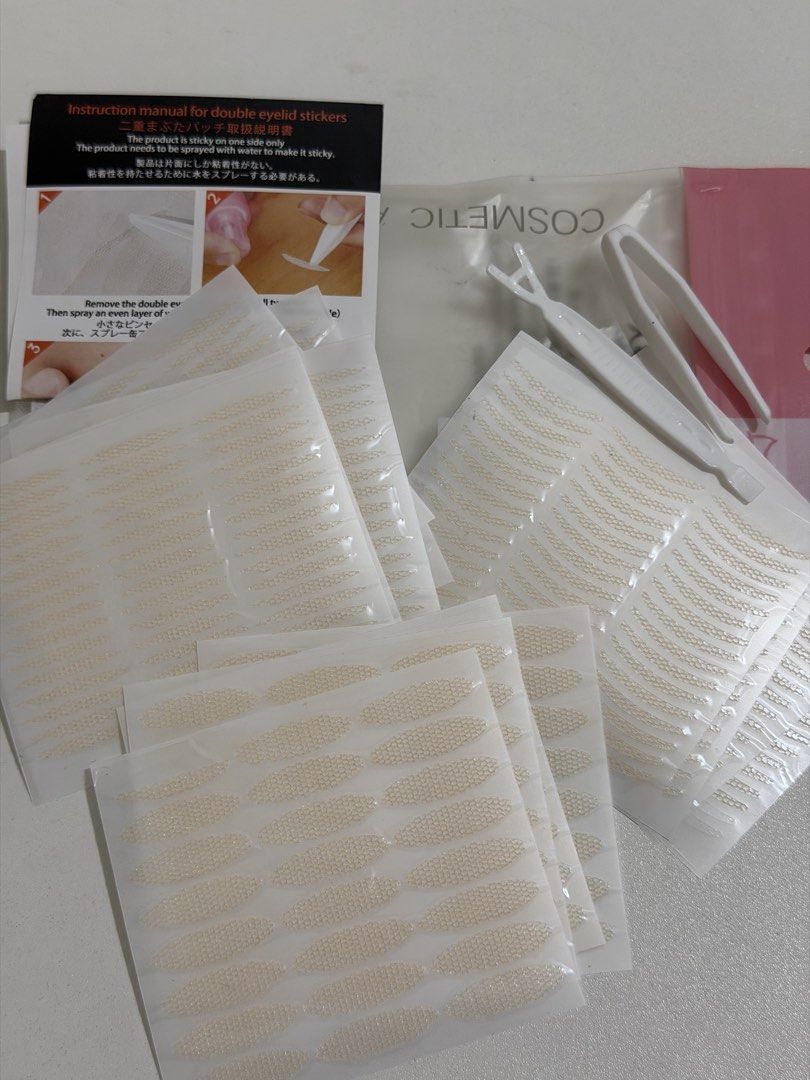Water-activated double eyelid stickers set with tools (Category: Makeup) located in Taguig. Submitted by deguzmanke83356 (Listing ID 1468325457, Image 1). Description: - Bundle of mesh double eyelid stickers in multiple shapes - Water-activated adhesive (just spray with water) - Includes applicator fork, tweezers, and instruction manual - Lots of sheets left, plenty of uses remaining - Perfect addition to your daily makeup routine.