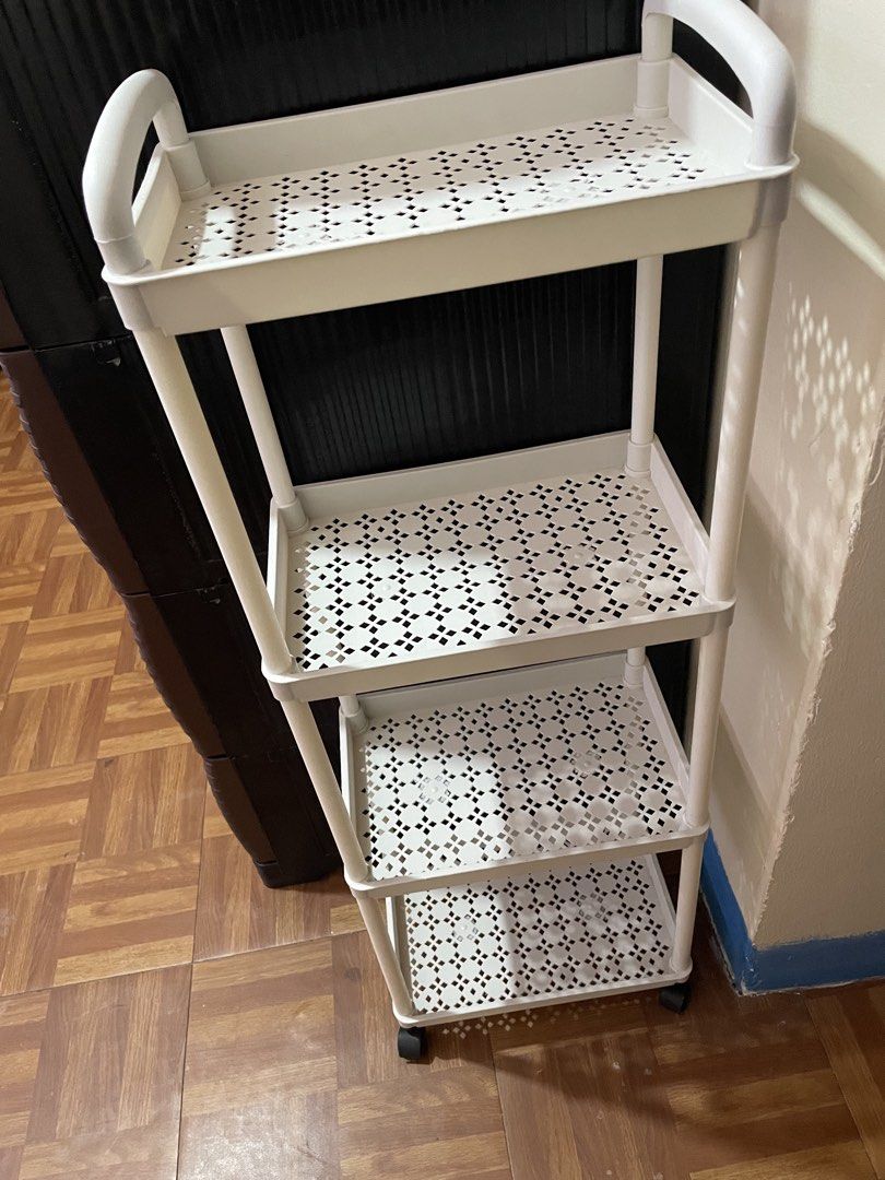White 4-Tier Rolling Storage Cart with Wheels (Category: Shelves, Cabinets & Racks) located in Calamba. Submitted by eli.chu (Listing ID 1468337530, Image 2). Description: ₱200 (both na) black and white ₱100 each.