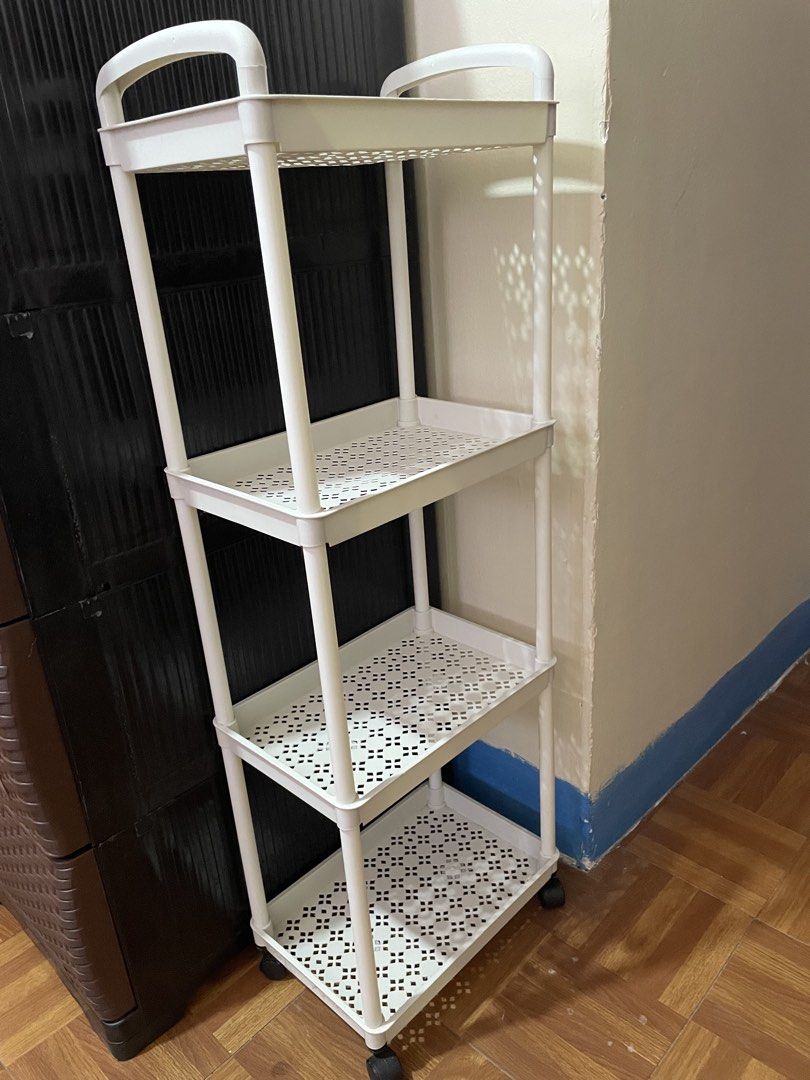 White 4-Tier Rolling Storage Cart with Wheels (Category: Shelves, Cabinets & Racks) located in Calamba. Submitted by eli.chu (Listing ID 1468337530, Image 3). Description: ₱200 (both na) black and white ₱100 each.