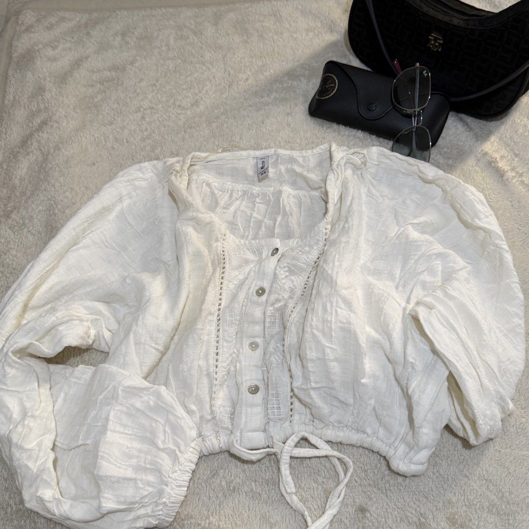 White Boho Button-Front Blouse with Puff Sleeves & Drawstring Waist (Category: Longsleeves) located in Pasay City. Submitted by bellita_05 (Listing ID 1468291692, Image 1). Description: Beautiful white blouse featuring puff sleeves, a button-front design, delicate embroidered details, and an adjustable drawstring waist for a flattering fit. Perfect for a feminine, casual, or boho-inspired look. ✨ Colour: White ✨ Style: Puff sleeves, button-front,