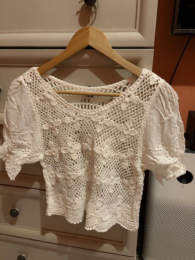 White Crochet Lace Top with Puff Sleeves (Category: Blouses) located in Quezon City. Submitted by mmiyah27 (Listing ID 1468370940, Image 3). Description: - once used only; recently bought for bora - Color: White - Material: Lightweight, breathable fabric - Design: Intricate open-work crochet lace with stitched flower details - Sleeves: Short puff sleeves with eyelet embroidery trim - Neckline: Scoop neckline - Styling: Perfect for warm weather; e