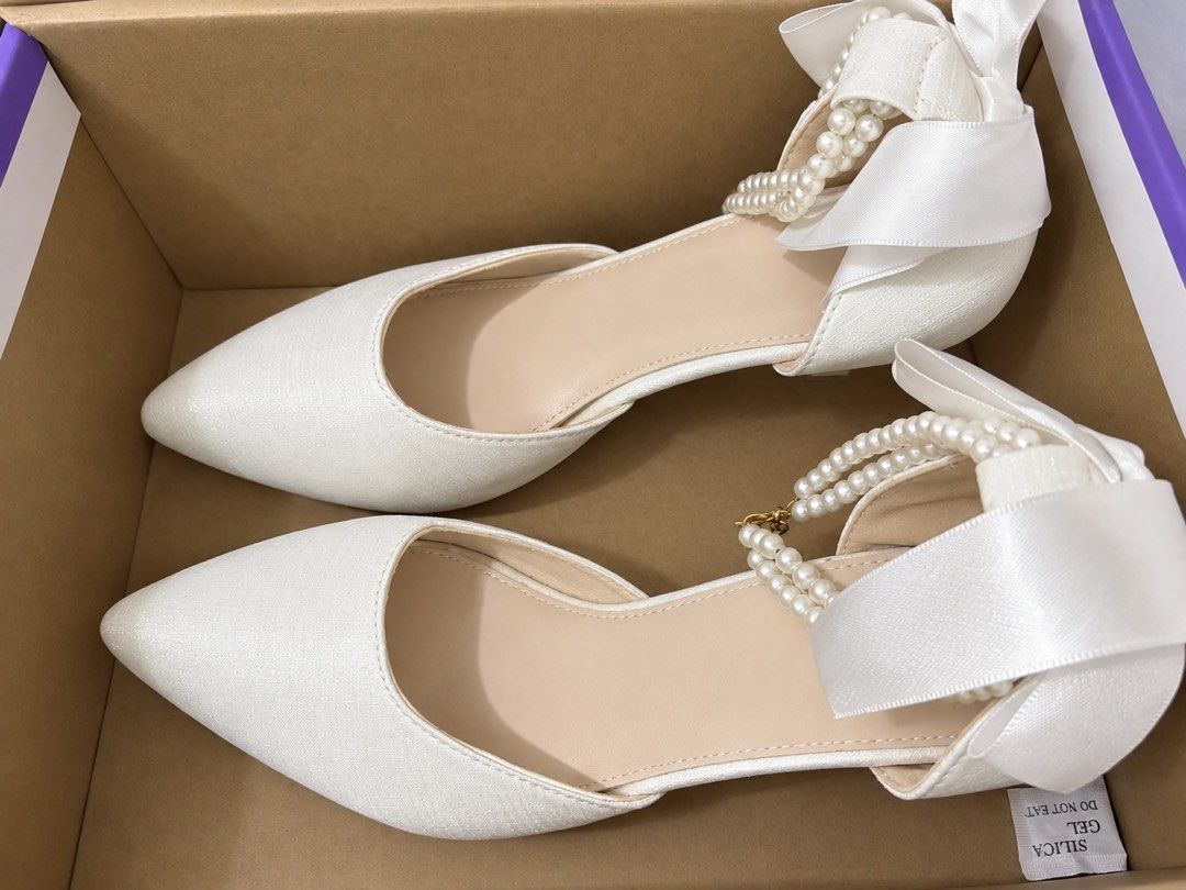 White Heels (Category: Heels) located in Manila. Submitted by janacamille_ (Listing ID 1468410104, Image 1). Description: 2.7 inch France Satin Bow pearl pointed heel Elegant Stiletto high heels wedding heels for women ~ only used once for graduation ~ no box included ~ bought: july 2026.