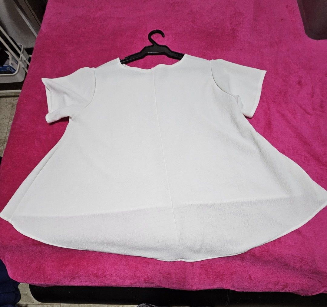 White High-Low Short Sleeve Blouse (Category: Blouses) located in Caloocan City. Submitted by rm.diaz (Listing ID 1468301719, Image 2). Description: - Color: White - Style: Short-sleeve top with round neckline and relaxed swing fit - Hemline: Trendy asymmetric high-low hem - Material: Smooth, comfortable textured fabric - Versatility: Solid plain design that is easy to match with jeans, shorts, or skirts.