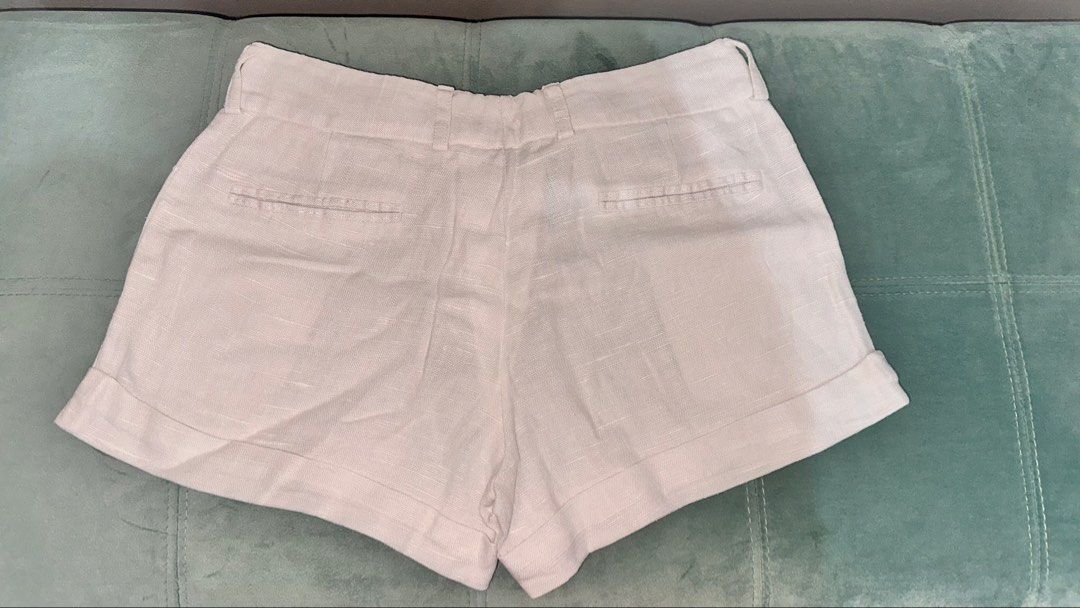 White Linen Shorts Size M (Category: Shorts) located in Quezon City. Submitted by angelique.jsd (Listing ID 1468447243, Image 3). Description: - Brand/Model: Salsatrends - Size: Medium - Color: White - Material: Lightweight textured fabric, ideal for warm weather - Details: Rolled cuffs, front button closure, and belt loops - Pockets: 2 front slip pockets and 2 back faux welt pockets - Condition: Clean and ready to wear Payment Method: 💙 GCash �