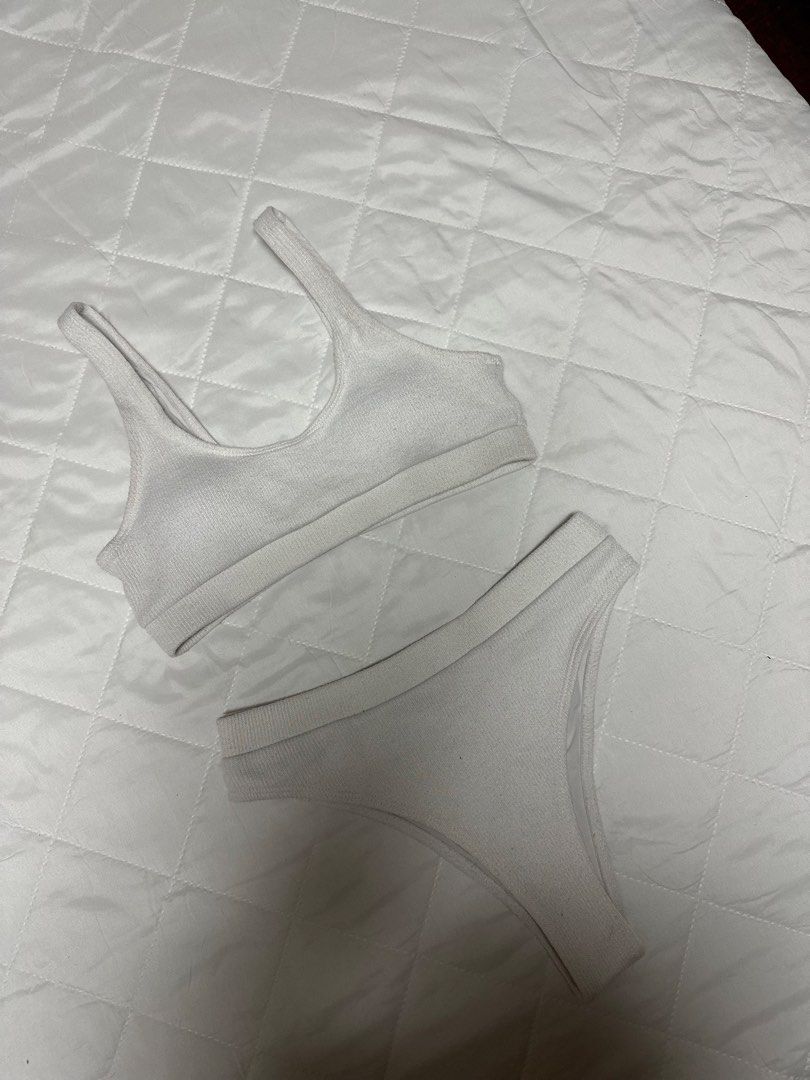 White ribbed bikini set two piece swimwear (Category: Bikinis & Swimsuits) located in Valenzuela. Submitted by prelovedbyramsie (Listing ID 1468419813, Image 1). Description: - Color: White - Material: Ribbed fabric - Design: Minimalist two-piece set - Top: Scoop neck with thick straps - Bottom: High-waisted cut.