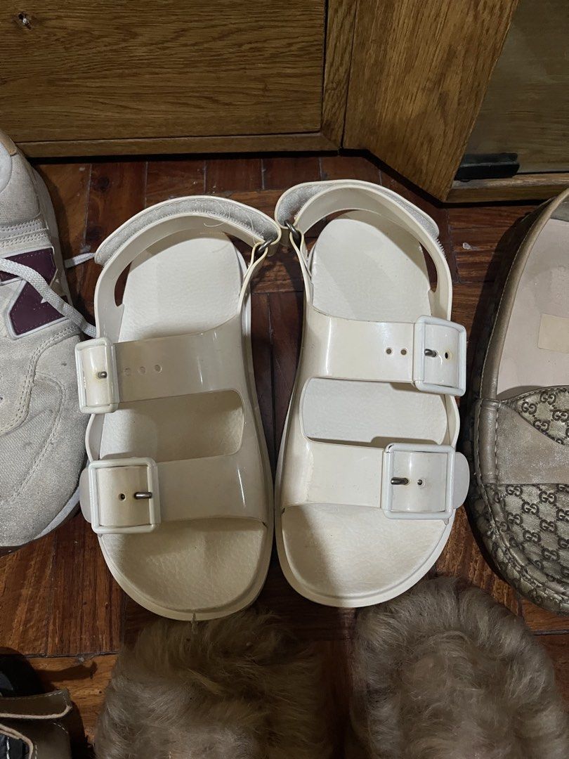 White Rubber Two-Strap Sandals (Category: Flats & Sandals) located in Manila. Submitted by evelyngrac95466 (Listing ID 1468323164, Image 1). Description: - Color: Solid white - Style: Dual strap buckle with adjustable ankle strap and easy slip-on design - Ideal for: Casual outings and beach days - Condition: Clean with minimal wear on the soles.