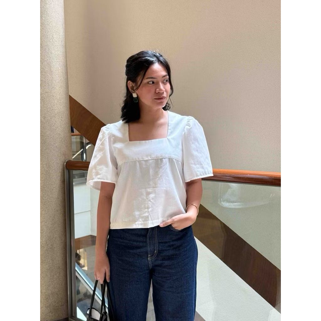 White Square Neck Blouse Puff Sleeves (Category: Blouses) located in Quezon City. Submitted by rightyriko (Listing ID 1468303155, Image 2). Description: - Color: White - Neckline: Square neck - Sleeves: Short puff sleeves - Size: Medium - Condition: Good, worn a few times and freshly washed - Styling: Easy to pair with denim jeans or skirts - RFS: A bit big for me .
