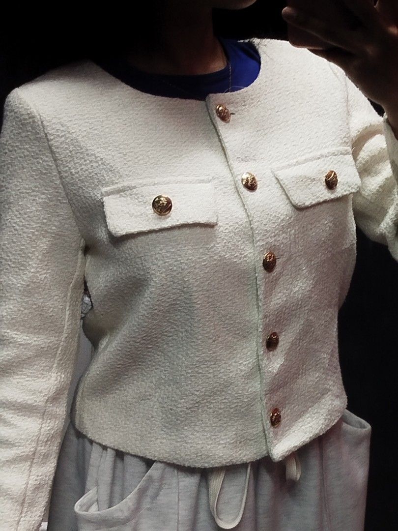 White Tweed Crop Jacket with Gold Buttons (Category: Coats, Jackets and Outerwear) located in Quezon City. Submitted by cuteitemsonlyyy (Listing ID 1468417145, Image 2). Description: - Color: White - Style: Tweed jacket with round neckline and long sleeves - Details: Front button closure and two faux chest pockets with gold-toned hardware - Fit: Cropped and structured.