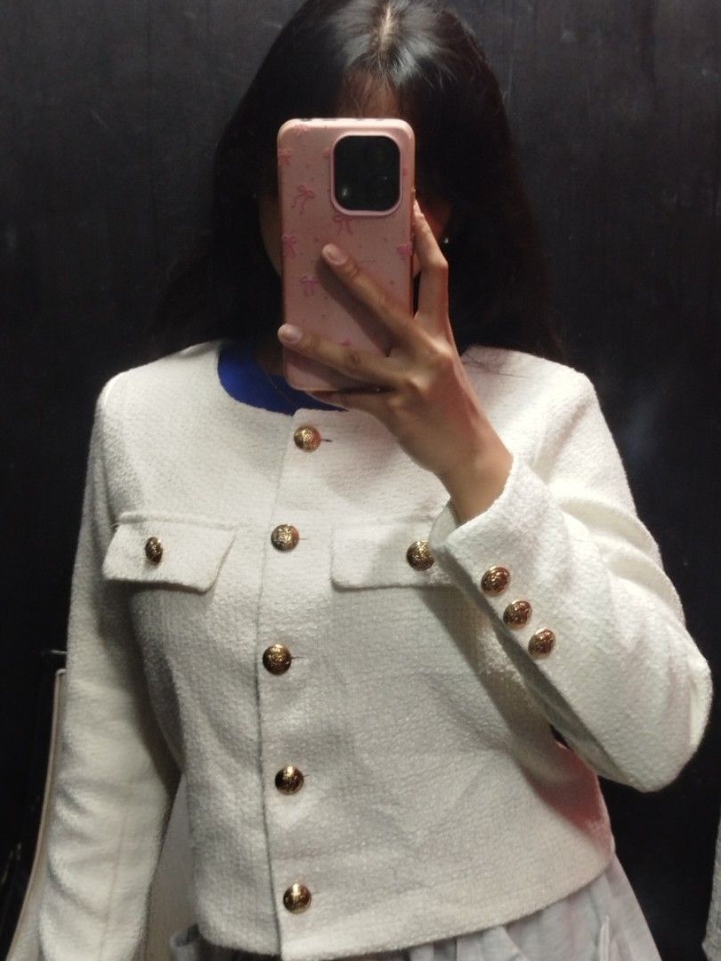 White Tweed Crop Jacket with Gold Buttons (Category: Coats, Jackets and Outerwear) located in Quezon City. Submitted by cuteitemsonlyyy (Listing ID 1468417145, Image 3). Description: - Color: White - Style: Tweed jacket with round neckline and long sleeves - Details: Front button closure and two faux chest pockets with gold-toned hardware - Fit: Cropped and structured.