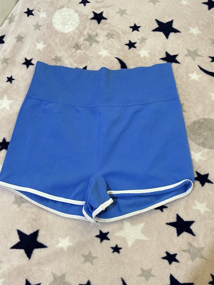 Wild Fable Blue Ribbed Athletic Shorts (Category: Activewear) located in Batangas. Submitted by lilirosie (Listing ID 1468344744, Image 1). Description: - Brand: Wild Fable - Size: Medium - Color: Bright blue with white piping trim - Material: Soft knit fabric with recycled nylon and spandex - Fit: High waistband - Condition: Great for workouts or casual lounging - Can fit to small din.