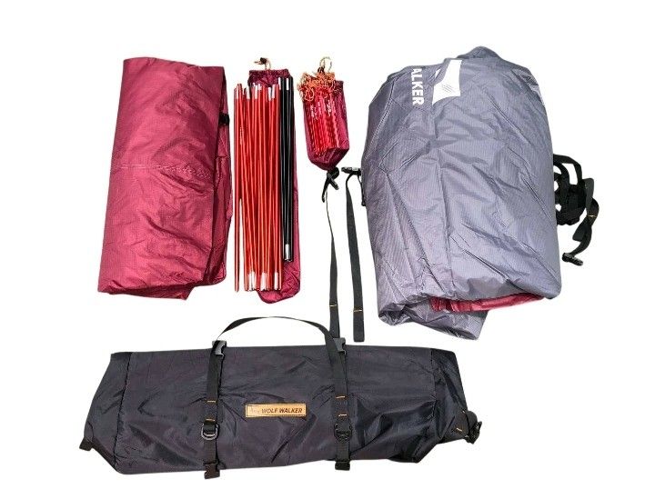Wolf Walker Camping Tent Multi-Room Grey Red (Category: Hiking & Camping) located in Abucay. Submitted by cristineca20489 (Listing ID 1468342296, Image 3). Description: - Brand/Model: Wolf Walker camping tent - Color: Grey and red - Layout: Multi-room with separate sleeping and living areas - Ventilation: Mesh windows for airflow - Setup: Easy assembly, perfect for weekend trips - Includes: Compact carrying bag, poles, and stakes - Condition: Cle